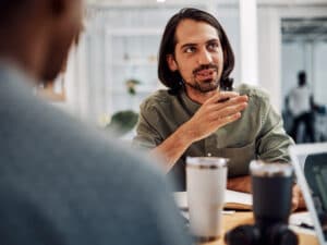 Colleagues talk at work