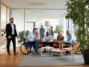 modern office environment, co-workers chatting