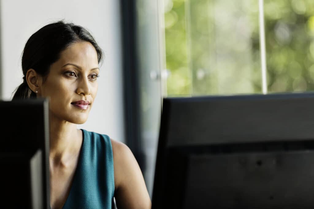 Businesswoman working on computer in office