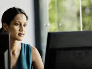 Businesswoman working on computer in office