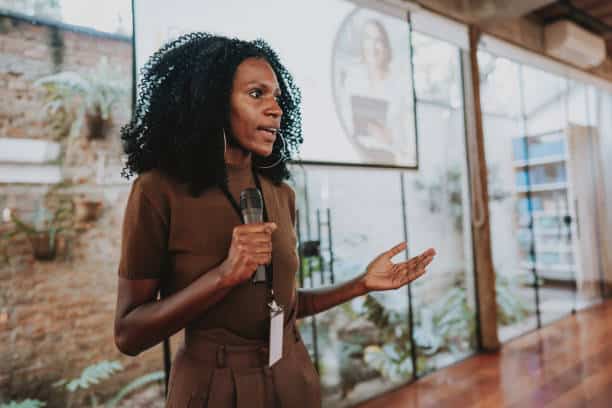 Woman giving speaker presentation