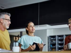 Male and female colleagues have a meeting at a table