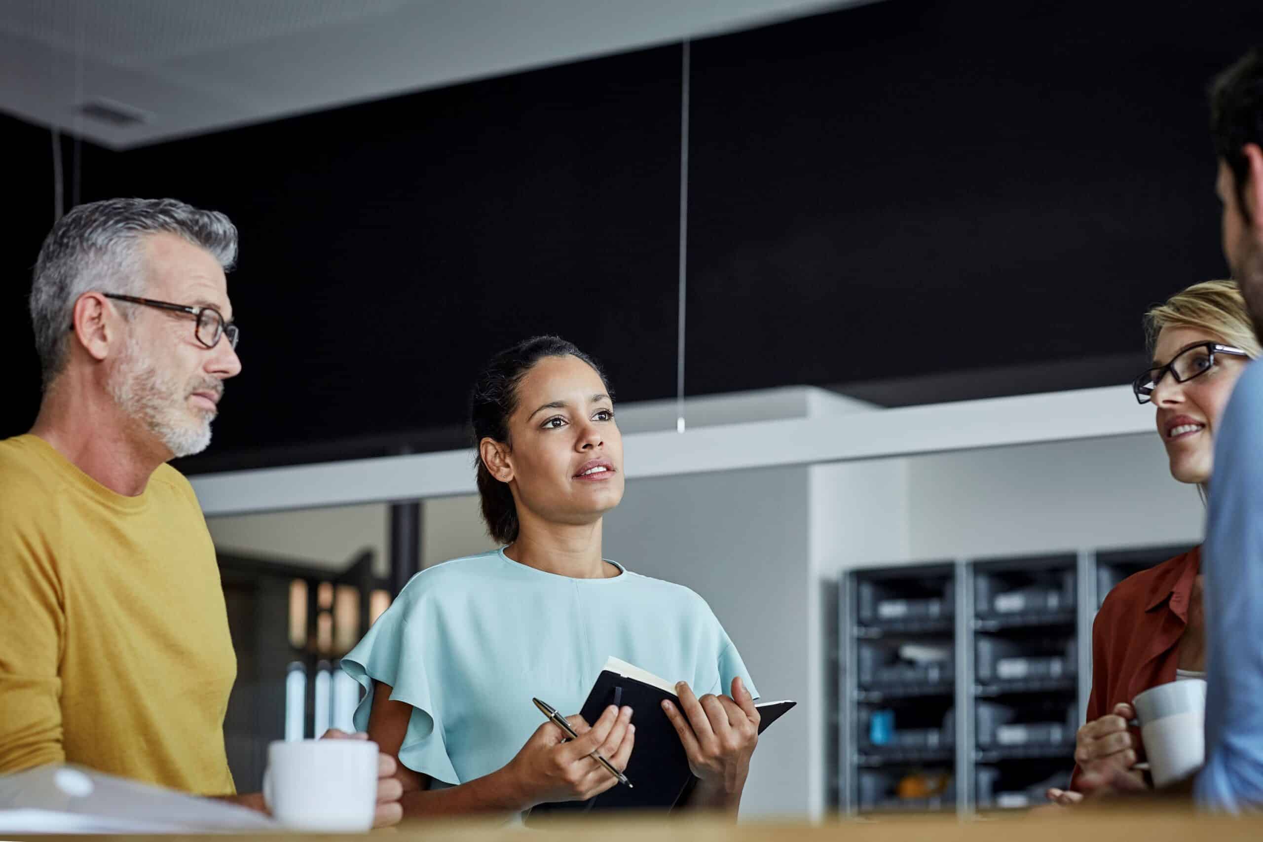 Male and female colleagues have a meeting at a table
