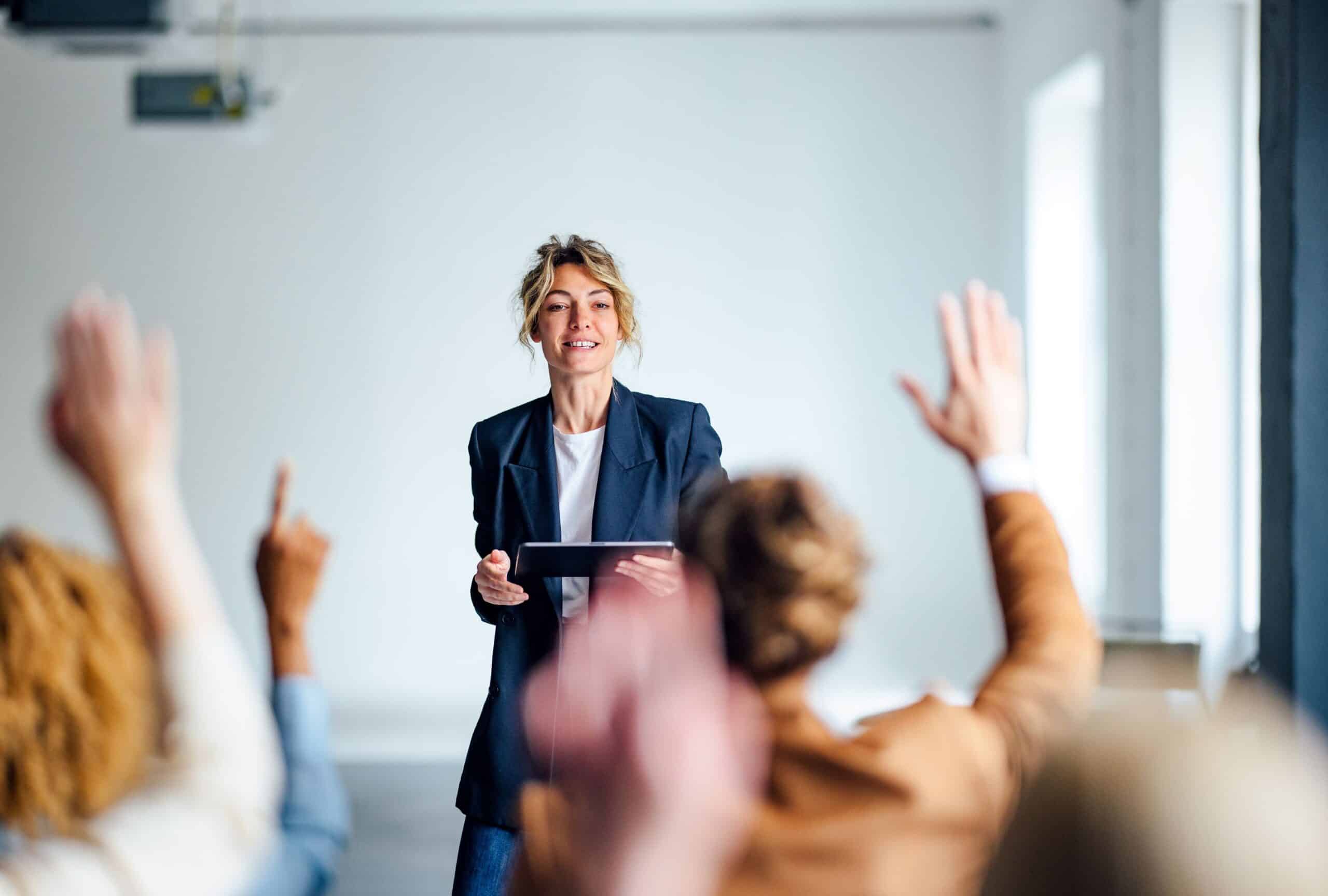 A woman taking questions during a presentation