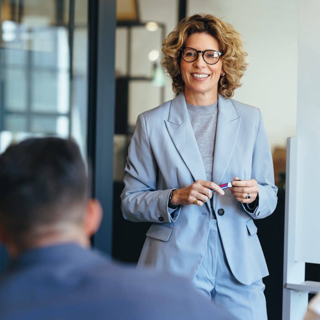 Business woman discussing something with her team