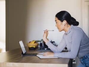 Serious Woman Talking on a Video Call at Home