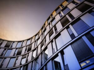 Glass facade of a modern office building in Hamburg, Germany.