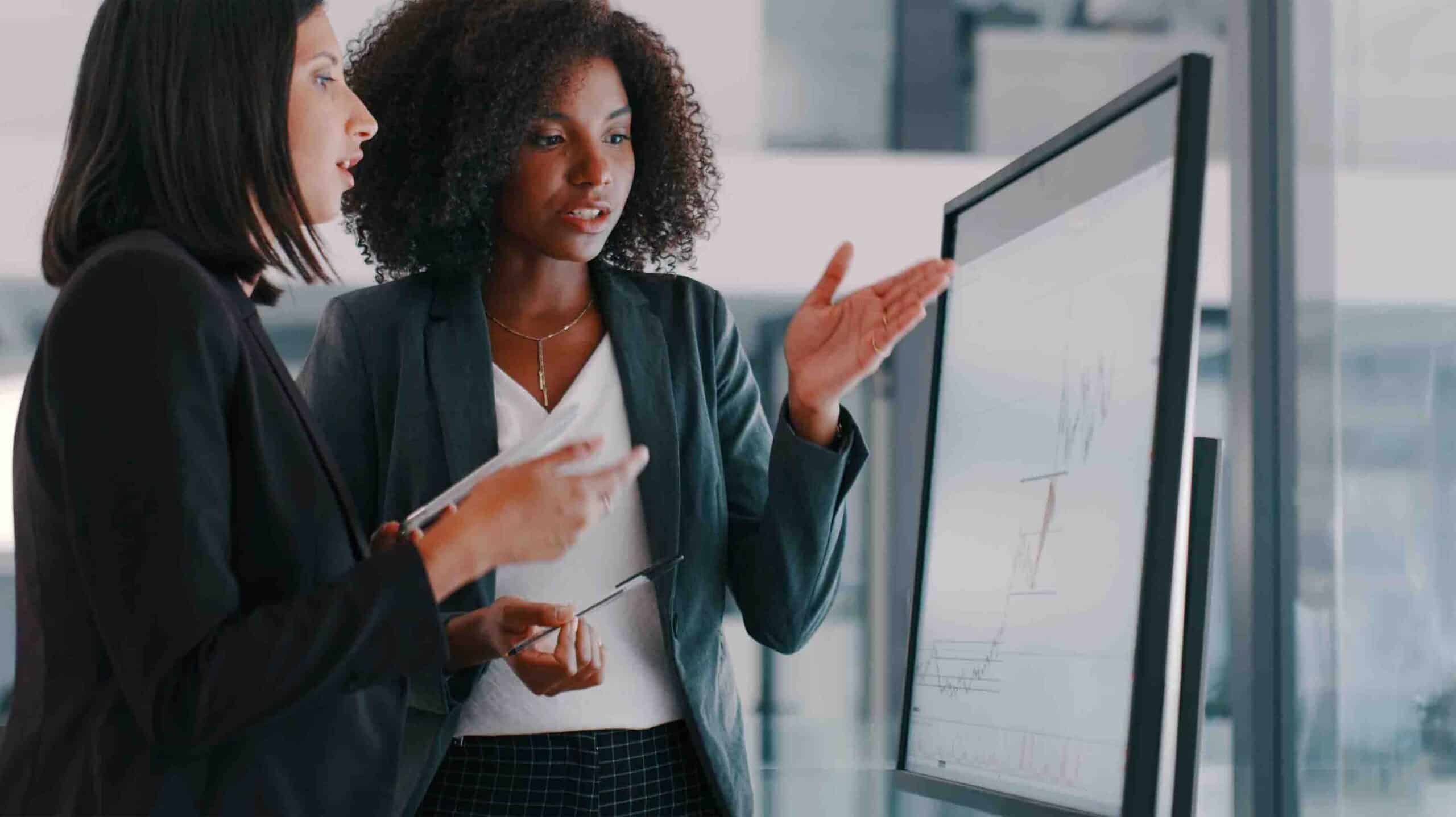 Women interacting with diagram on monitor
