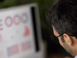 Close up of a man looking at graphs