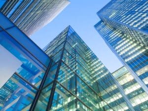 Glass skyscrapers against blue sky in London