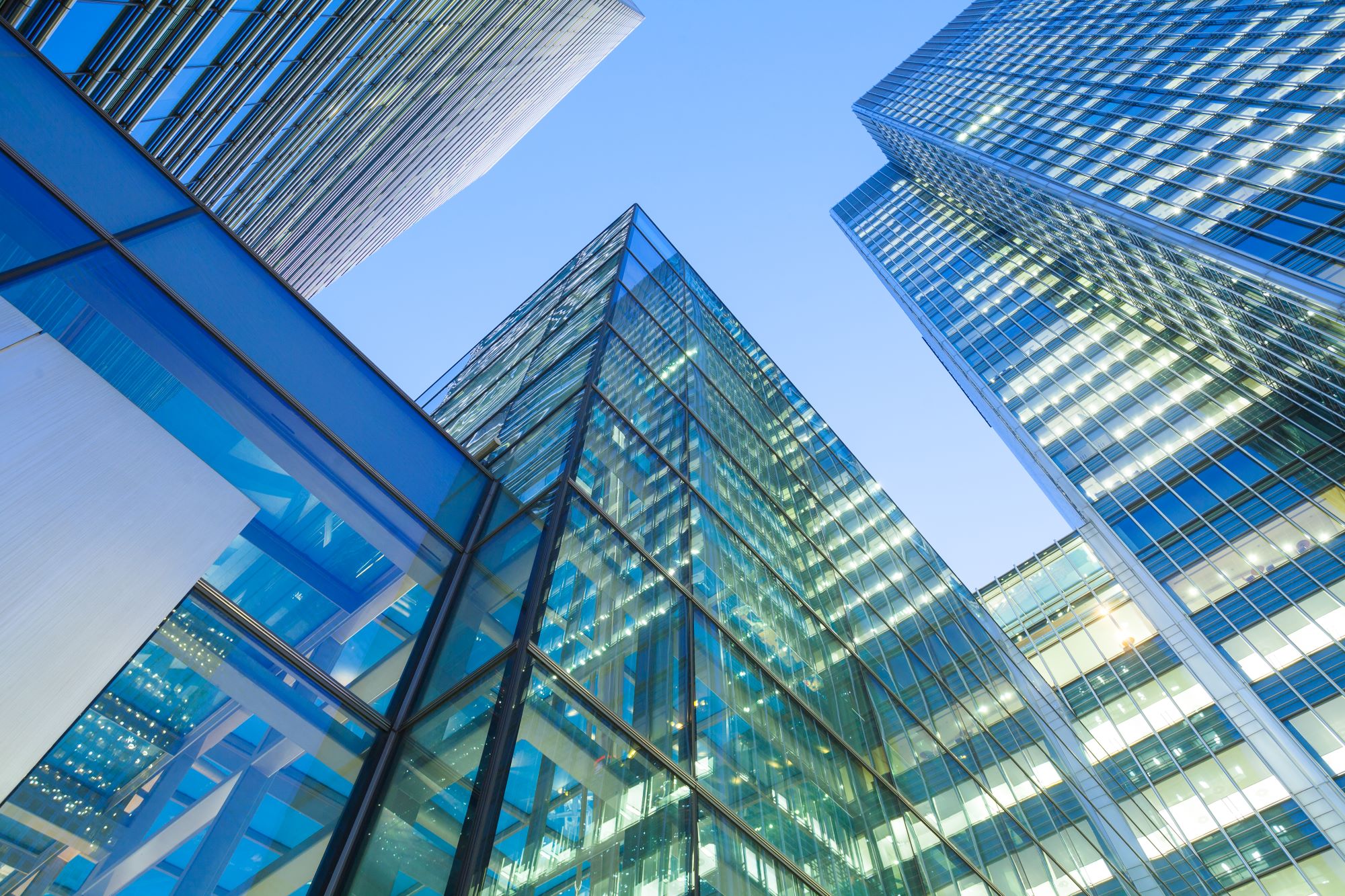Glass skyscrapers against blue sky in London