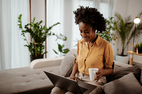 Detail_Woman working from lounge at home_iStock-1322247690- reduced