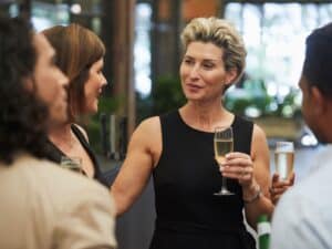 A group of people enjoying drinks in a corporate setting