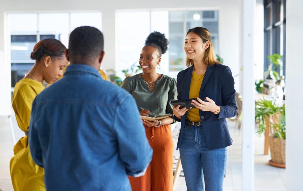 Group of professionals chatting and laughing