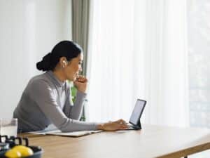 Smiling Woman Talking on a Video Call at Home