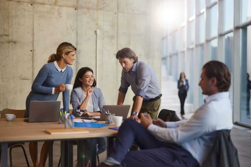 Group of happy entrepreneurs working on a meeting in the office.