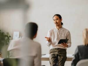 Business Meeting with Presenter in Modern Office Setting