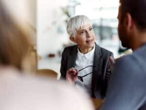 People engaging in a deep conversation in a corporate environment