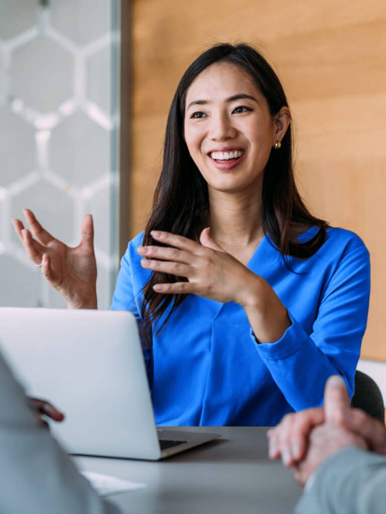 Group of business persons talking in the office.