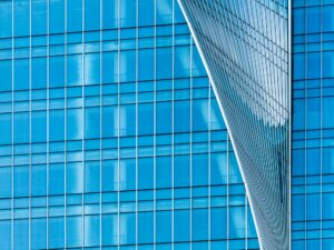 A close-up of blue glass building