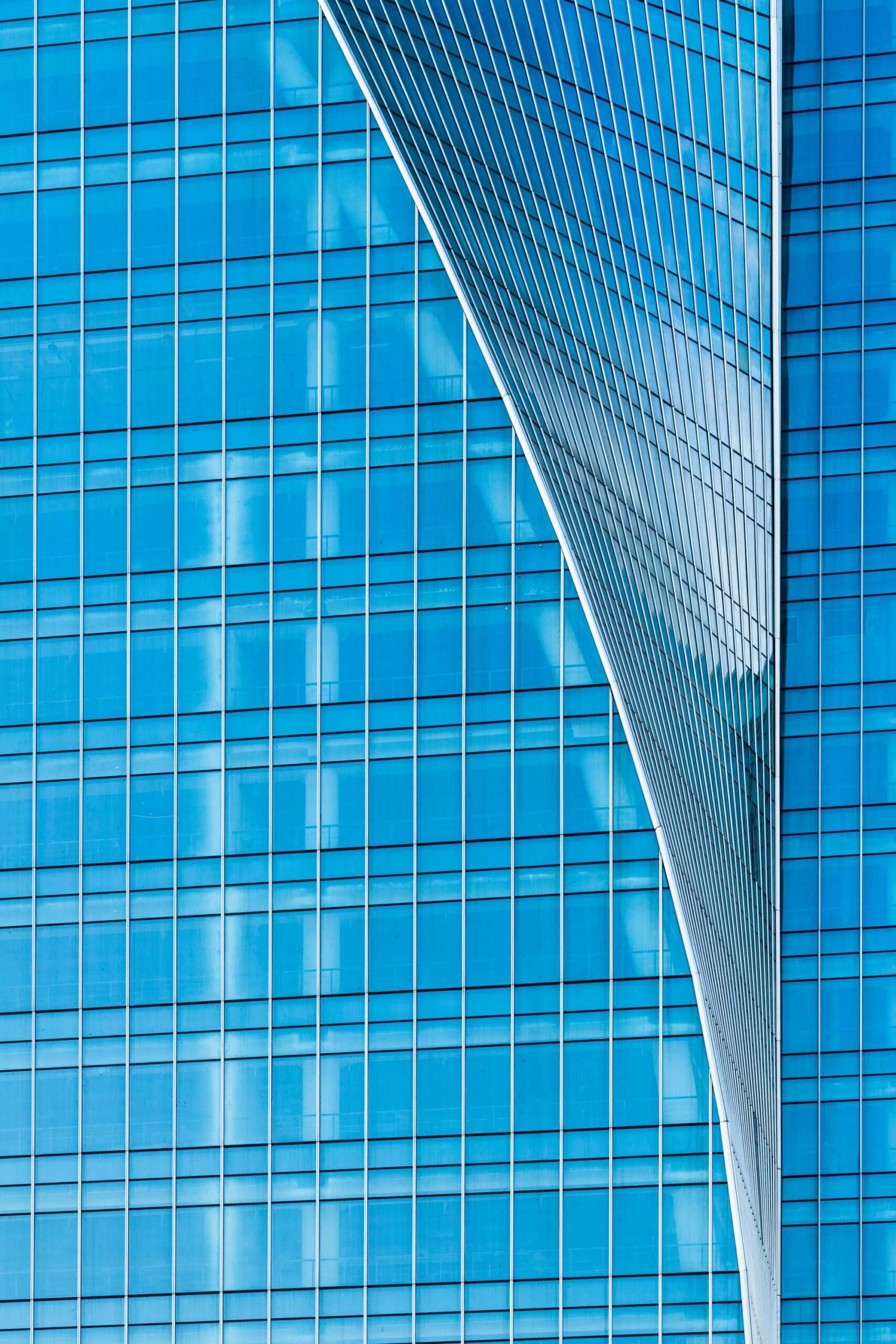 A close-up of blue glass building