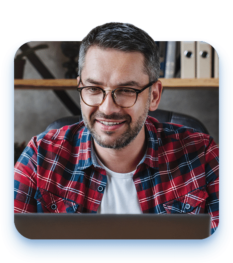 White male working on laptop at home