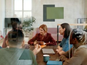 Detail_Board meeting around table with devices_pexels-diva-plavalaguna-6146816